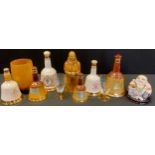Bell's Scotch Whisky bottle, full, 50cl; another; others, empty; a jolly Buddha; etc