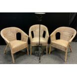A set of three garden or conservatory wicker armchairs, and a wrought iron pot stand, 123cm tall, (
