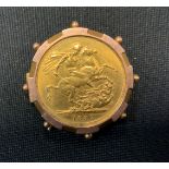 A Victorian sovereign brooch, 1887, indistinctly marked mount, 11.6g gross