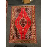 A Mazlaghan rug / carpet, 190cm x 125cm.