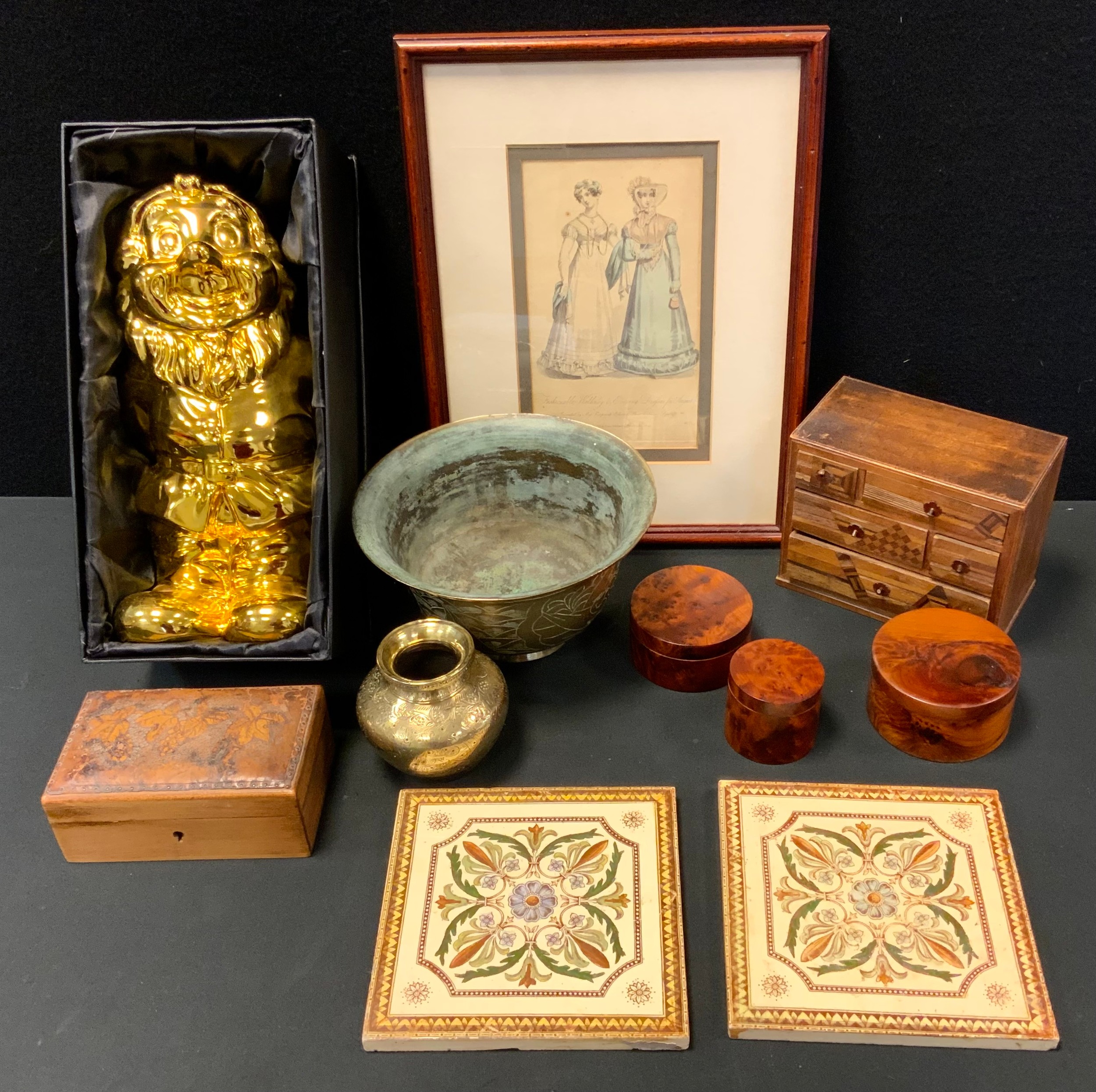 A miniature marquetry inlaid chest of drawers, fitted with an arrangement of five drawers, 12cm