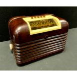 A vintage Bush DAC 10 valve radio, cream and brown Bakelite case, amber coloured selector buttons,