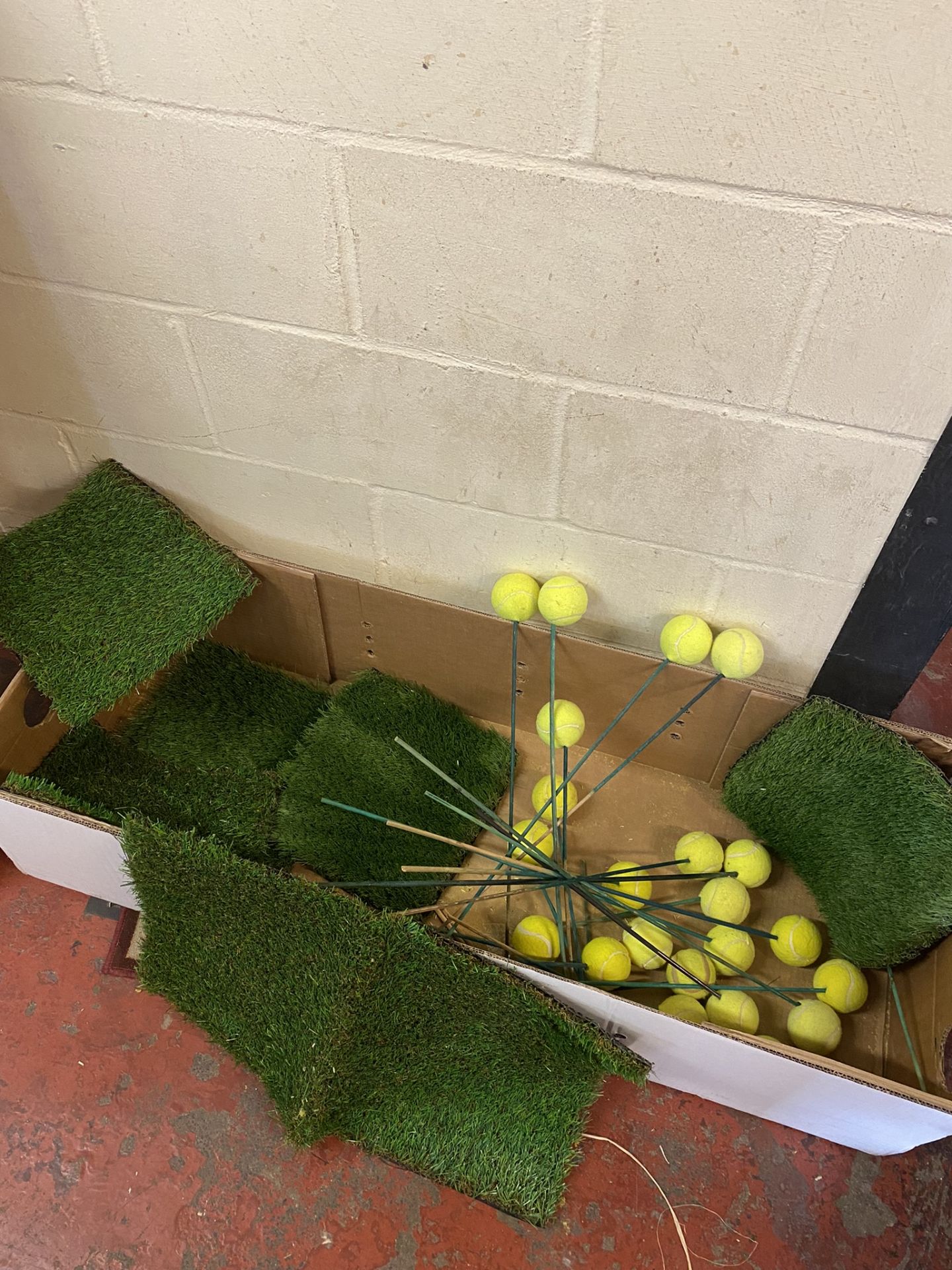 Collection of Training Tennis Balls on Sticks with Artificial Grass