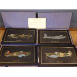 4 Bomber plane plaques in boxes