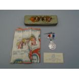 Silver jubilee (1910-1939) tin with medal and handkerchief and a city of Birmingham card