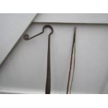 Vintage shepherd's crook and carriage whip with makers name