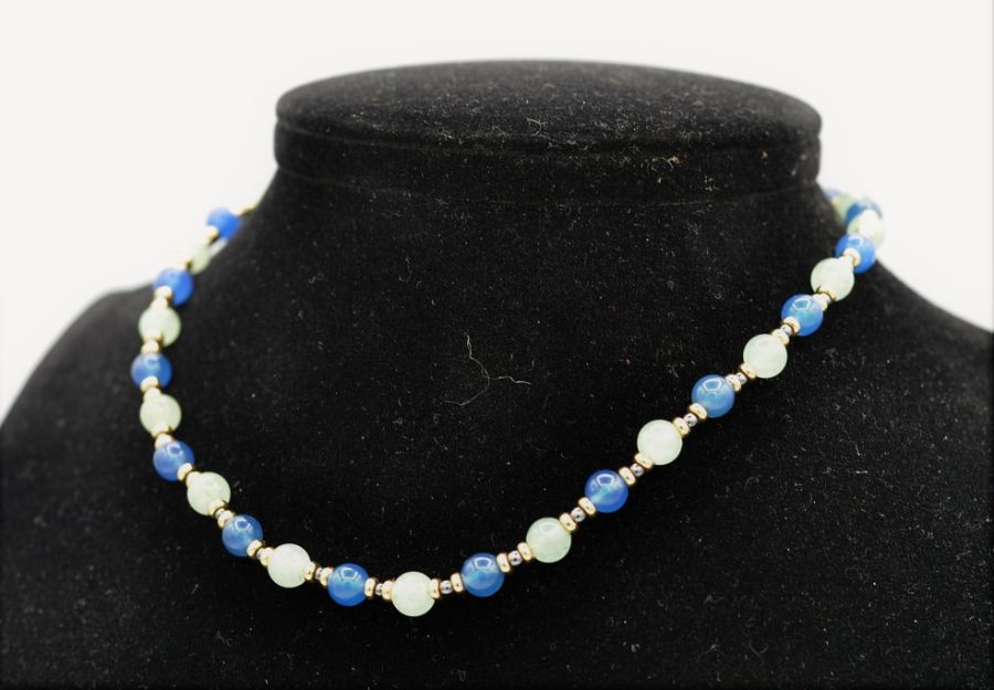 Lapis and opal beads, interspersed with eighteen carat gold rondelles and finished with an - Image 3 of 3