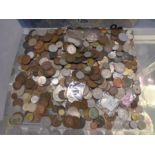 A tub of mixed loose coins mostly British copper and silver mix