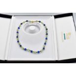 Lapis and opal beads, interspersed with eighteen carat gold rondelles and finished with an