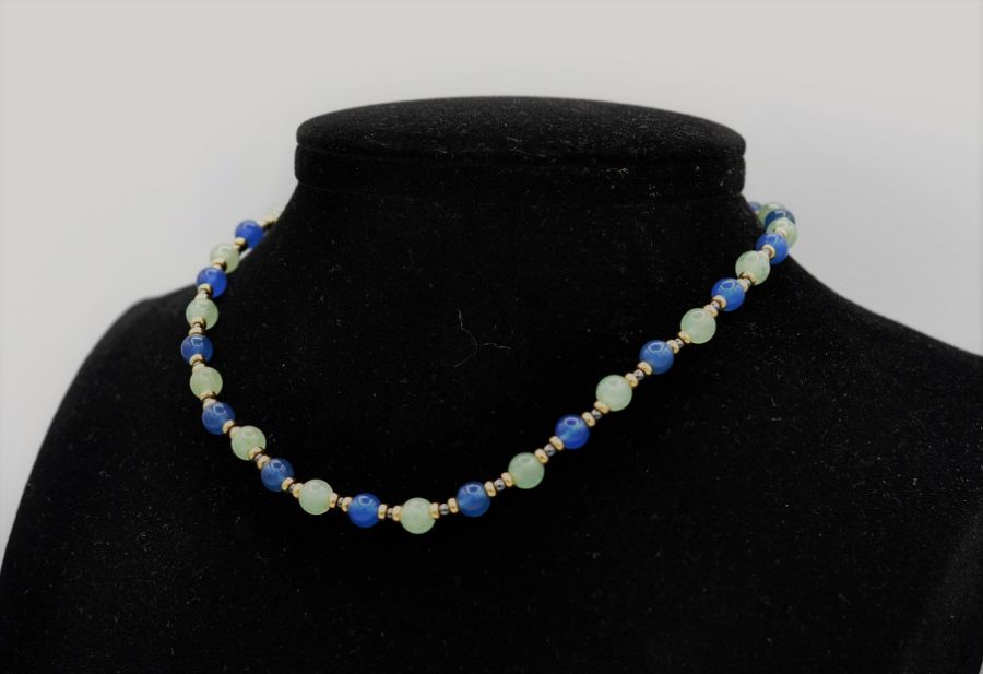 Lapis and opal beads, interspersed with eighteen carat gold rondelles and finished with an - Image 2 of 3