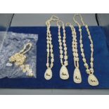 White carved necklaces