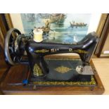 vintage Singer sewing machine in wooden box with leaflet and original oil