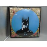 A batman record/ comic print - a record mounted onto Batman comic in a frame