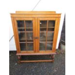 Glazed Oak bookcase on stand H127cm W93cm D31cm approx