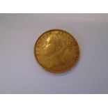 An 1877 Sydney Mint Victoria young head shield back gold sovereign 8.02g