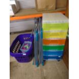 Multi drawer storage on wheels and 2 purple laundry baskets, a box of pegs and 2 clothes airers