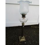 Oil lamp with glass font, white tulip shade and brass base