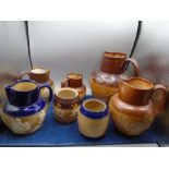 Royal Doulton Lambeth stoneware harvest jugs and tobacco jars (no lids) in both brown and blue,