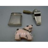 Beattie lighter, an unusual lighter in the form of a dog and a acme whistle