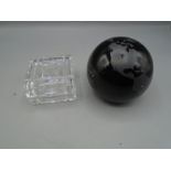 A glass globe paperweight and a glass trinket pot