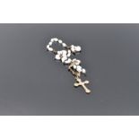 9ct gold crucifix 0.8g and rosary beads with white metal crucifix