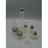 Scent/dressing table bottles, some with silver collars and lids