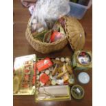 A sewing basket with contents, a tin of buttons and a tin of cotton reels