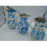 3 Victorian Stoneware Lidded pitchers tallest 23cm approx. with a snake thumb hinge, mid size jug by