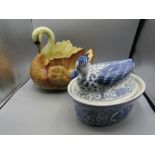 A duck egg crock and a swan planter
