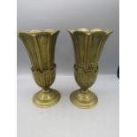 A pair of brass vases