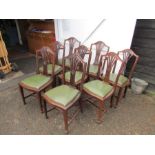 8 Wolfe and Hollander mahogany dining chairs including 2 carvers with green leather seat pads