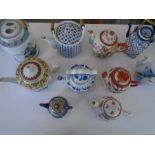 10 Oriental style Teapots (2 with liners some repair work to lid of one pot)