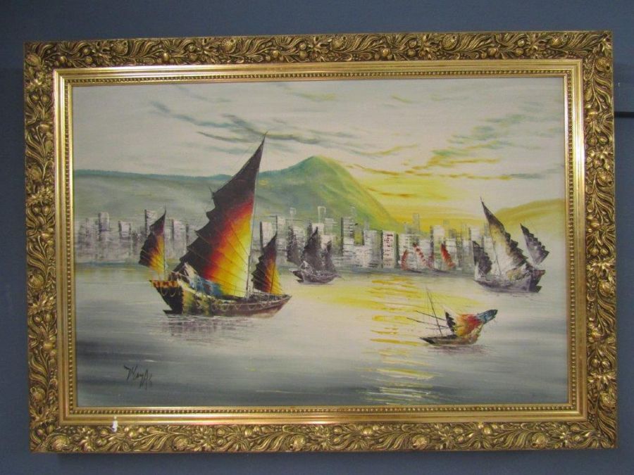 oil on board of a coastal city scene signed 'Thomas' in guilt frame 87x62cm