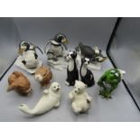 Animal figurines to include The Humane society seal pup figures (with certs) penguins, bunnies, cats