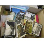A box of loose vintage postcards including newspaper postcards of Diana plus an empty photo album