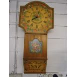 Th0s Kent wall clock, wooden with floral design