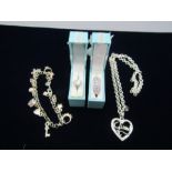 Silver dress rings, a charm bracelet and a 'guess' necklace, all stamped 925. 58 gms gross weight