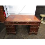Partners desk with one central drawer flanked by 4 drawers each side and brown leather inlaid top
