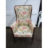 Upholstered wingback fireside chair