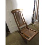 Vintage wooden deck chair with cushions