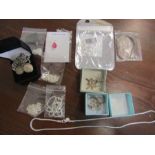 A quantity of sterling silver chains, a locket, a St Christopher all stamped 925 or sterling silver