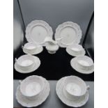 A vintage part tea set comprising 2 cake plates, 6 cups and saucers and a milk jug