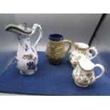 A lidded jug, a West Germany jug and 2 vintage floral jugs