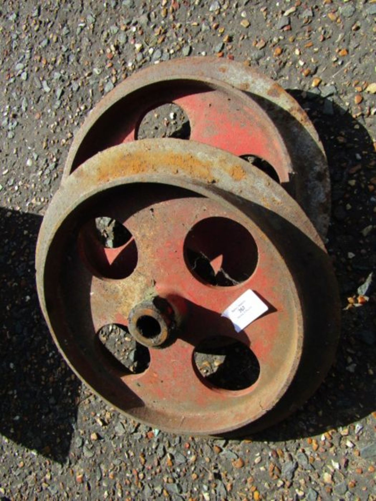 pair of caste iron wheels