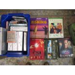 Box of assorted cassette tapes, box set dvds and a box of teach yourself tapes