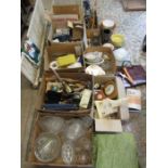 A stillage of mixed items to include china, glassware, kitchenalia, tools, leather bag, clocks,