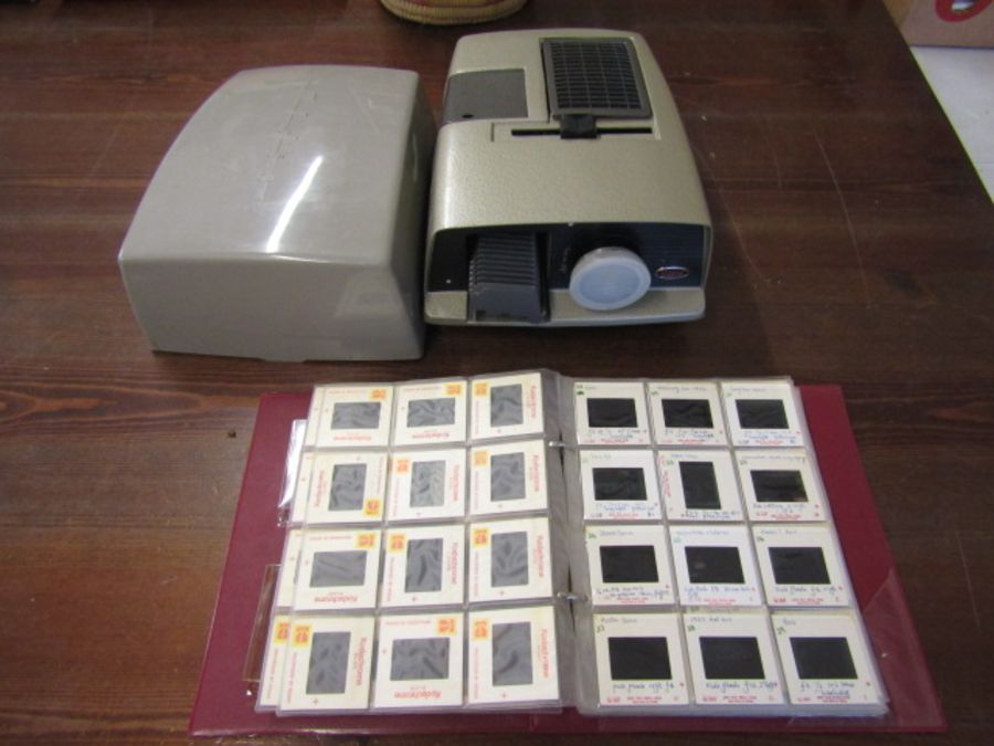 vintage Aldis projector (for display) and a folder of slides