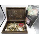 A box of mixed coinage and a few bank notes