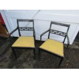 Pair of ebonised carver chairs with upholstered seats