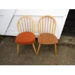 A pair of Ercol Blonde windsor kitchen chairs